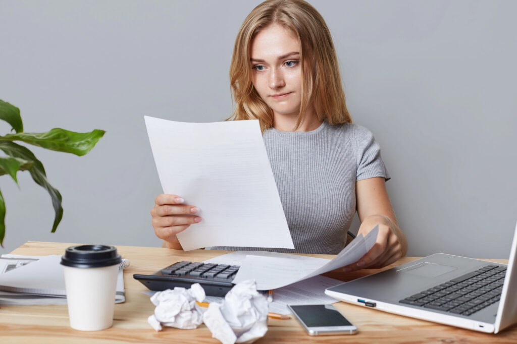 Freelancer reading a client contract before deciding whether to sign