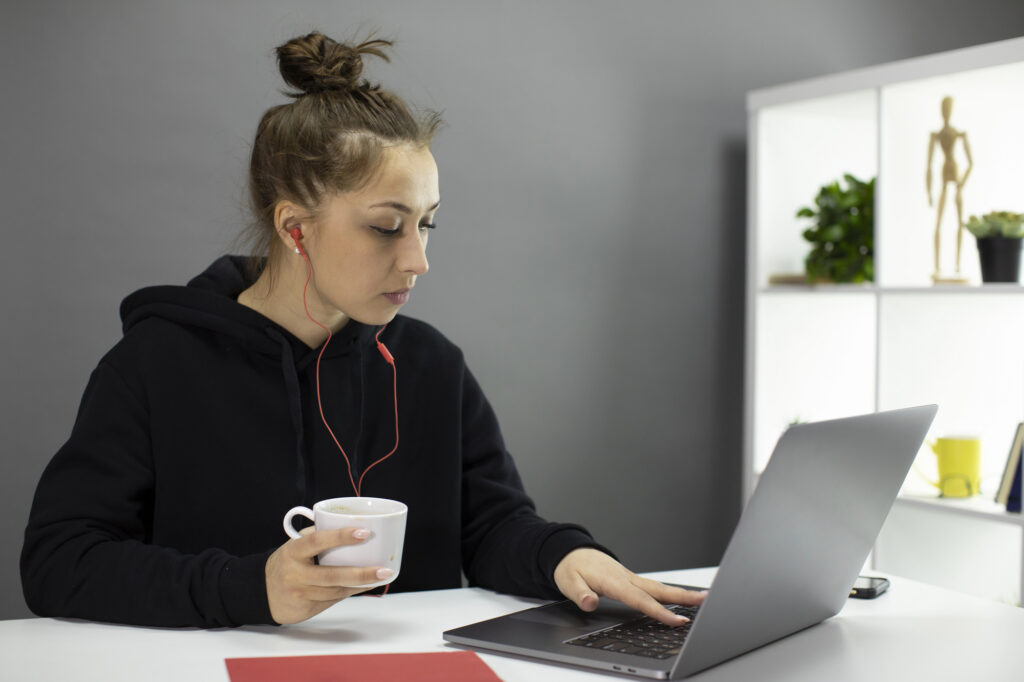 Woman working casually while tracking time in Toggl showing data privacy considerations