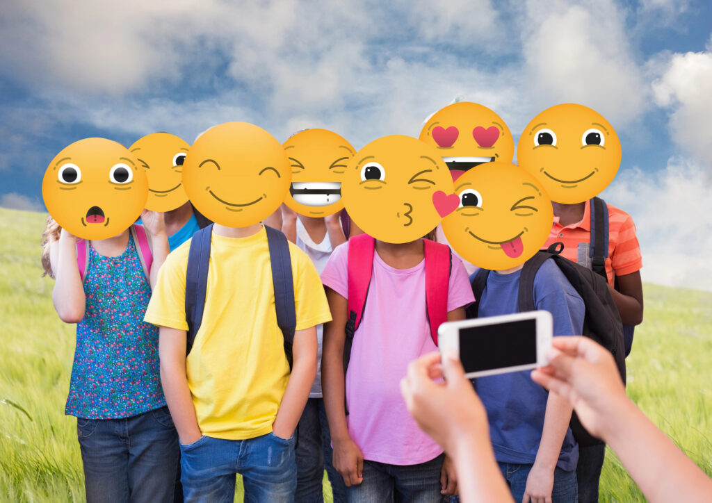 Children with faces hidden by emoji masks illustrating concerns about Instagram AI and children's photographs.