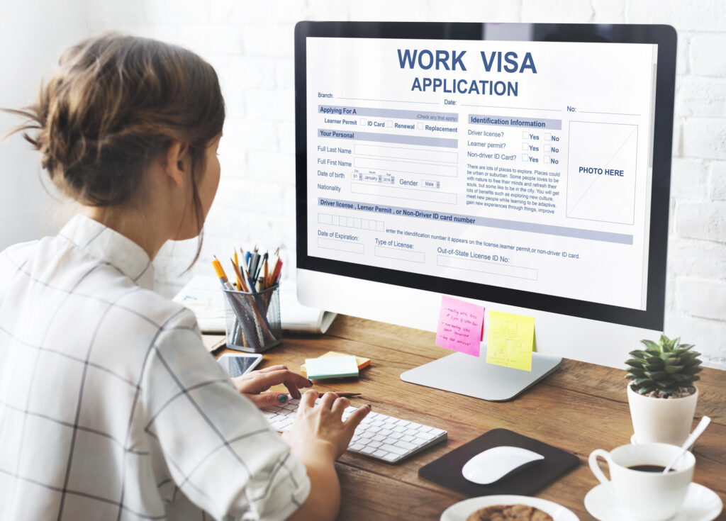 Virtual assistant helping a client with a work visa application online