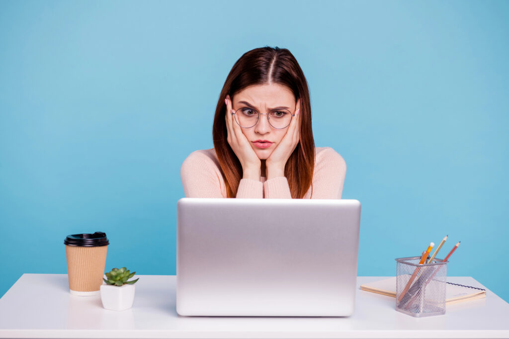 Freelancer considering a Right to Work check on her laptop